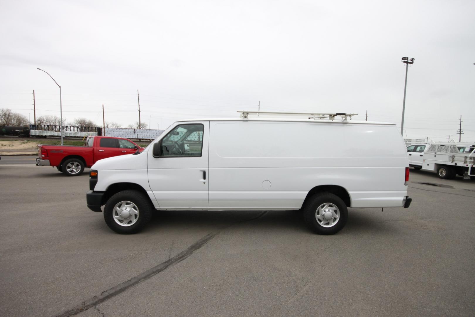 2014 White /Grey Ford E-Series Van (1FTSS3EL3ED) with an 5.4L V8 engine, Automatic transmission, located at 4562 State Avenue, Billings, MT, 59101, (406) 896-9833, 45.769516, -108.526772 - 2014 Ford E-350 Super Duty Extended Cargo Van - One owner - 62,000 miles! 5.4L V8 SOHC 16V FFV Engine - 4 speed automatic transmission - rear wheel drive - 62,752 miles - One owner - Inspected and serviced - Ready to go to work today! Air conditioning - tilt steering wheel - AM/FM audio - powe - Photo#0